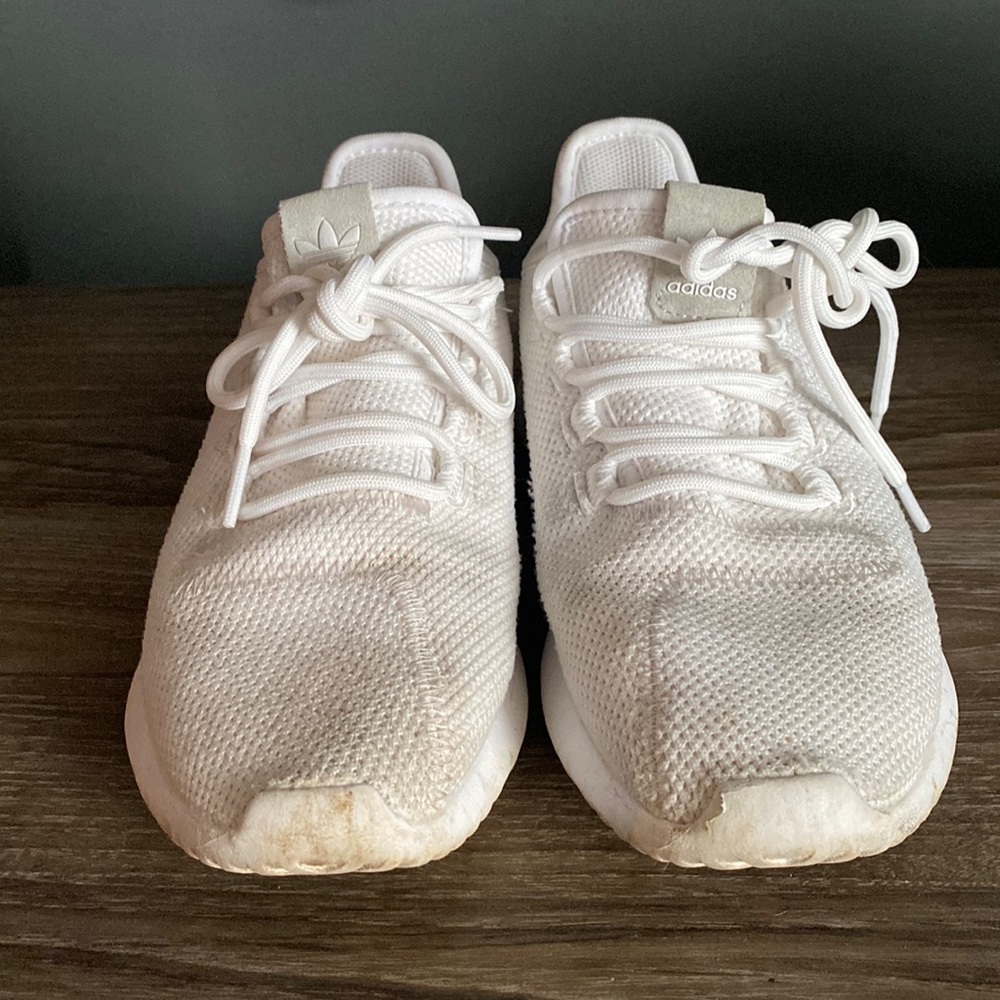 Adidas all white sneakers.